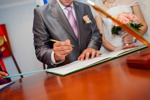 the-hand-of-a-young-man-who-signs-in-the-registry-2023-11-27-05-18-07-utc